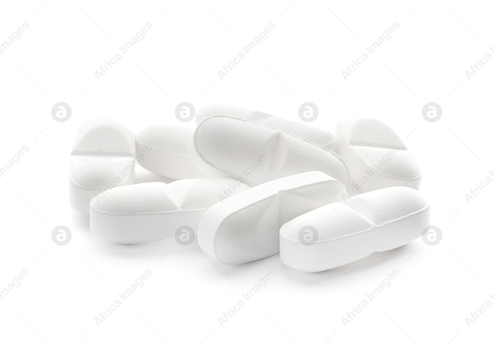 Photo of Heap of pills on white background