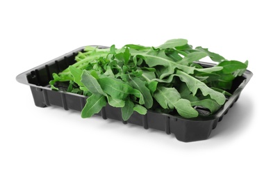 Photo of Heap of fresh arugula leaves isolated on white