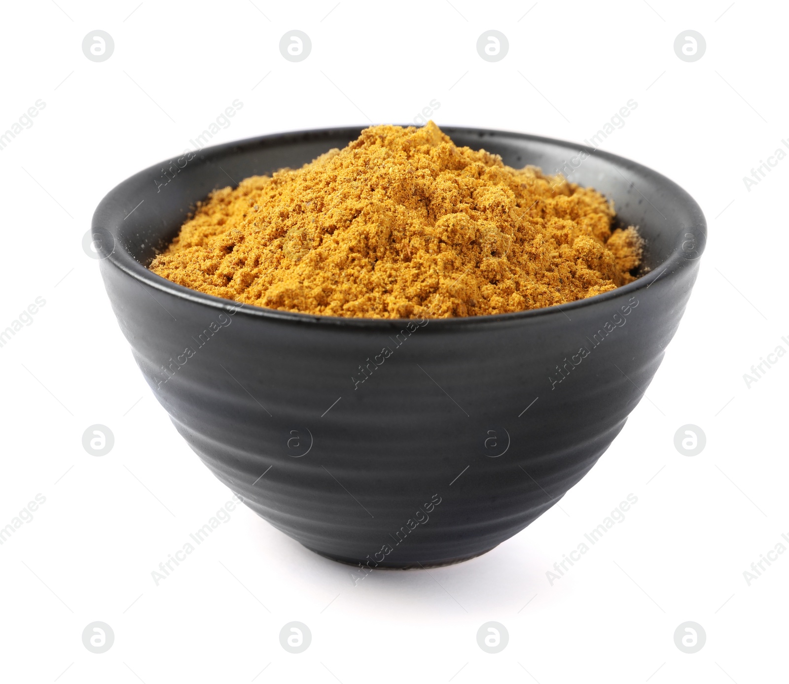 Photo of Dry curry powder in bowl isolated on white