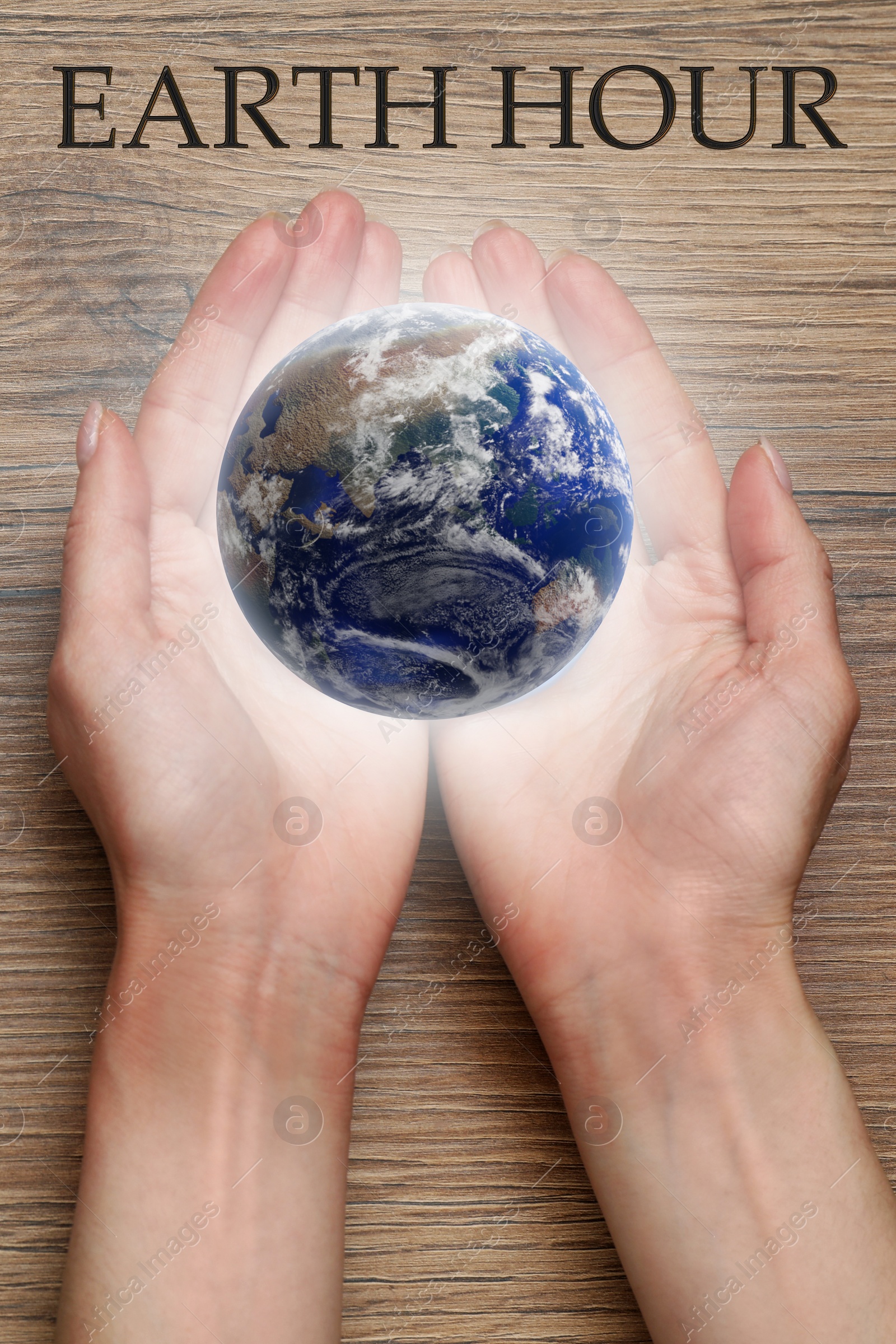 Image of Take care of Earth, turn off lights for hour. Woman with illustration of planet at wooden table, top view