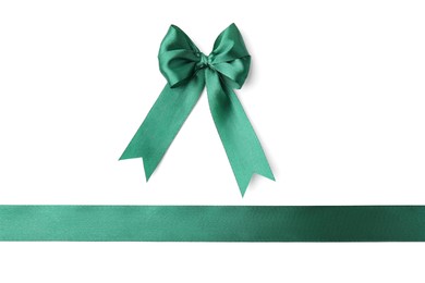 Green satin ribbon with bow isolated on white, top view