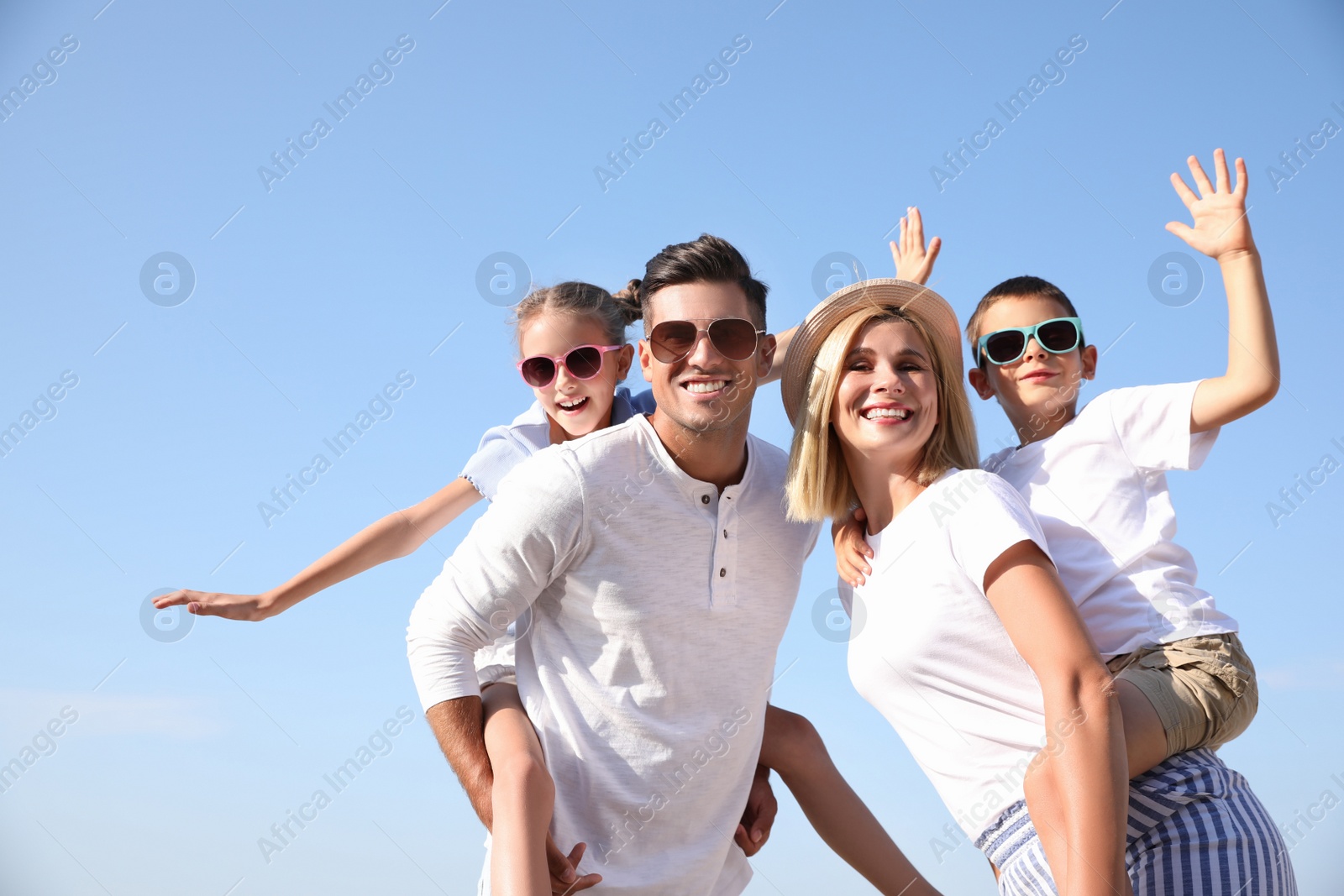 Photo of Happy family outdoors on sunny summer day