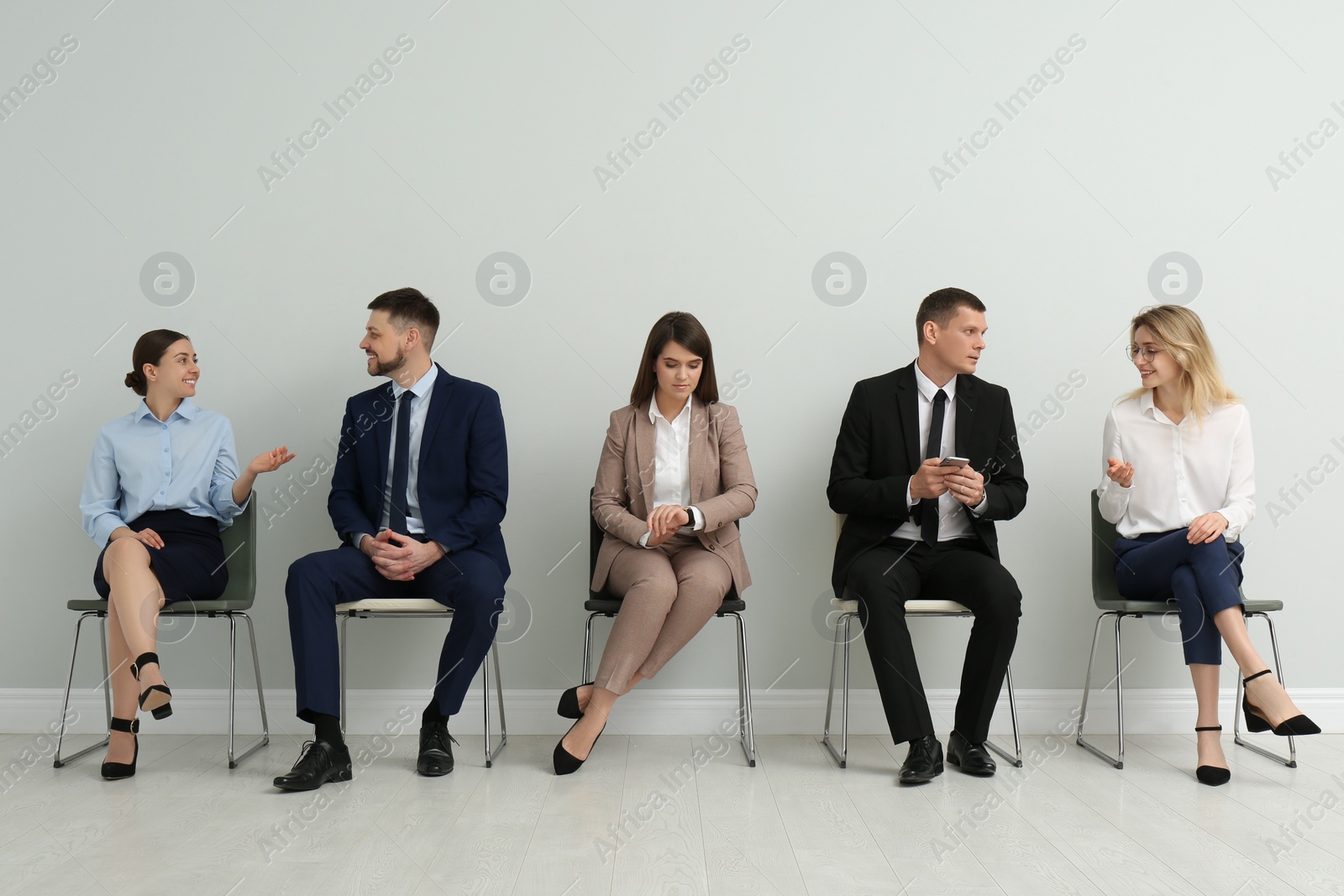 Photo of People waiting for job interview in office hall