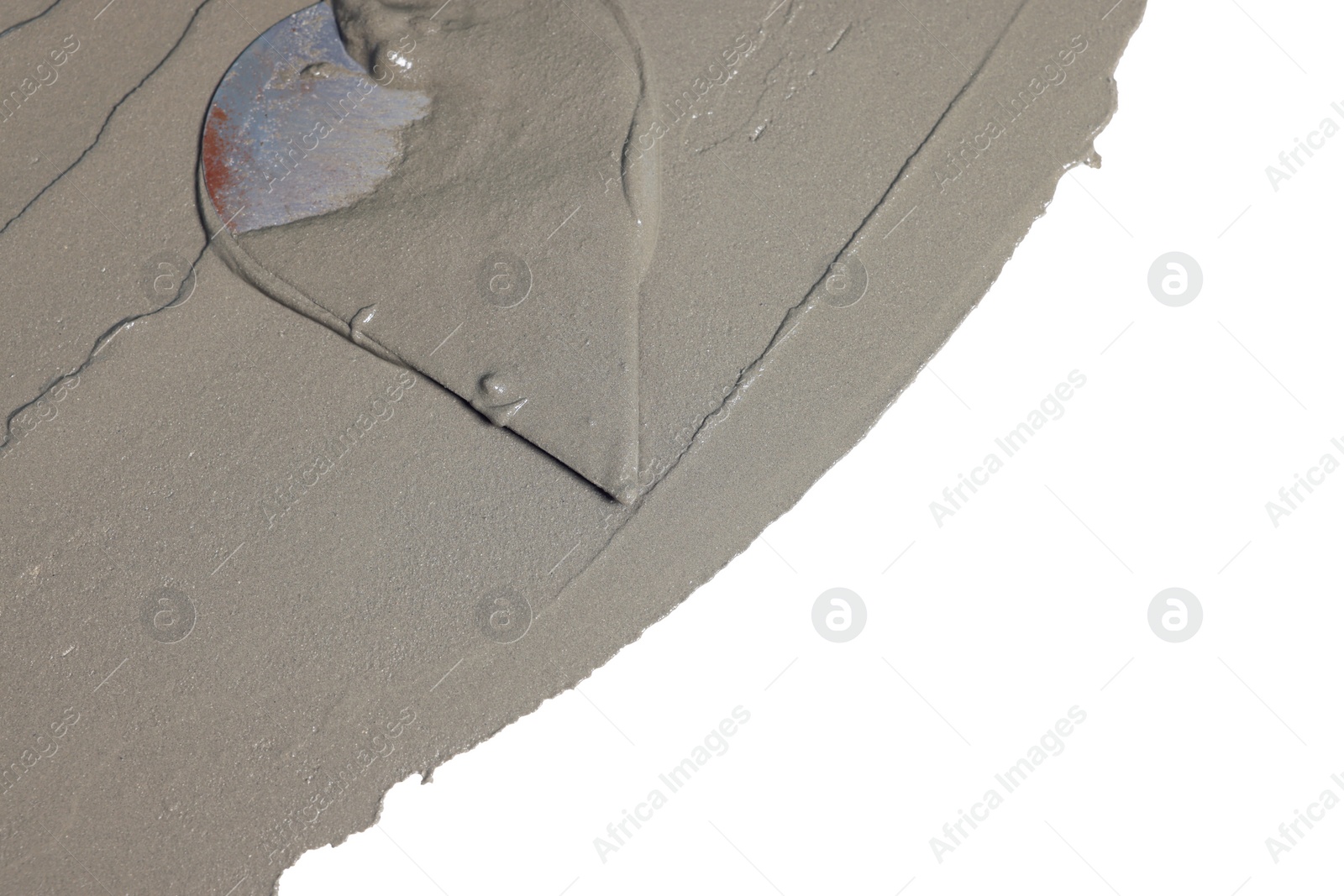 Photo of Wet concrete and trowel on white background, top view. Space for text