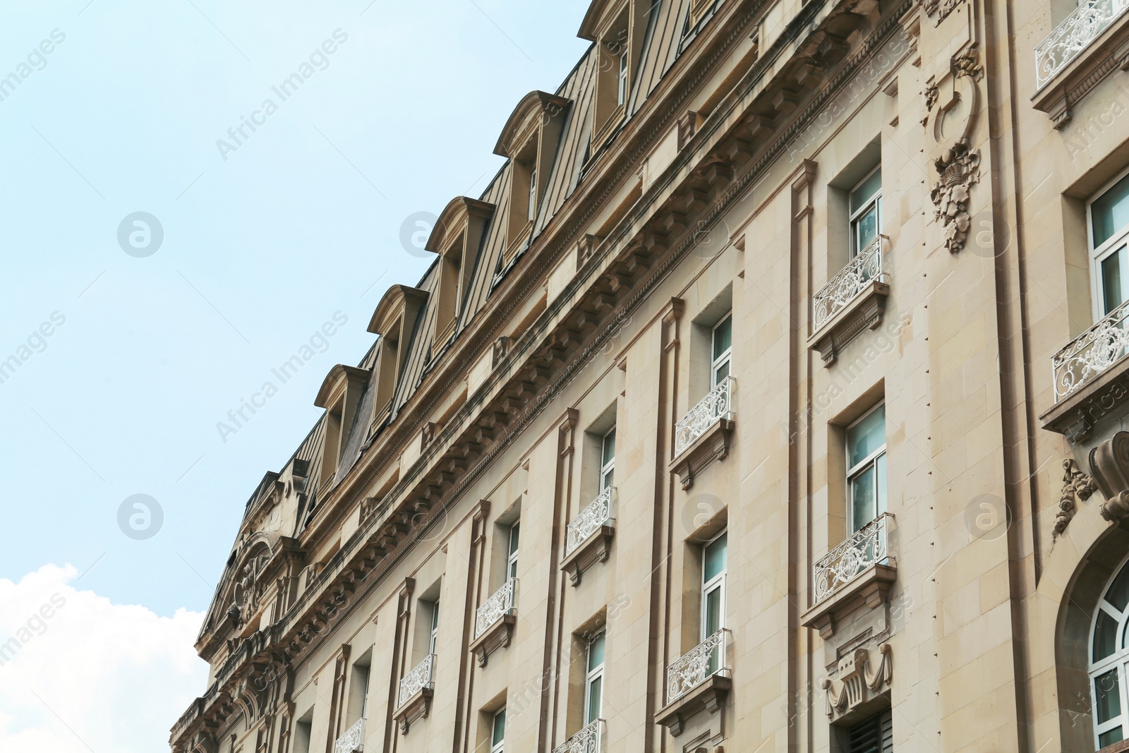 Photo of Exterior of beautiful old building with many windows