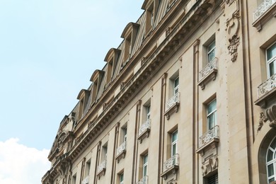 Photo of Exterior of beautiful old building with many windows