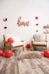 Photo of Cozy living room decorated for Valentine Day. Interior design