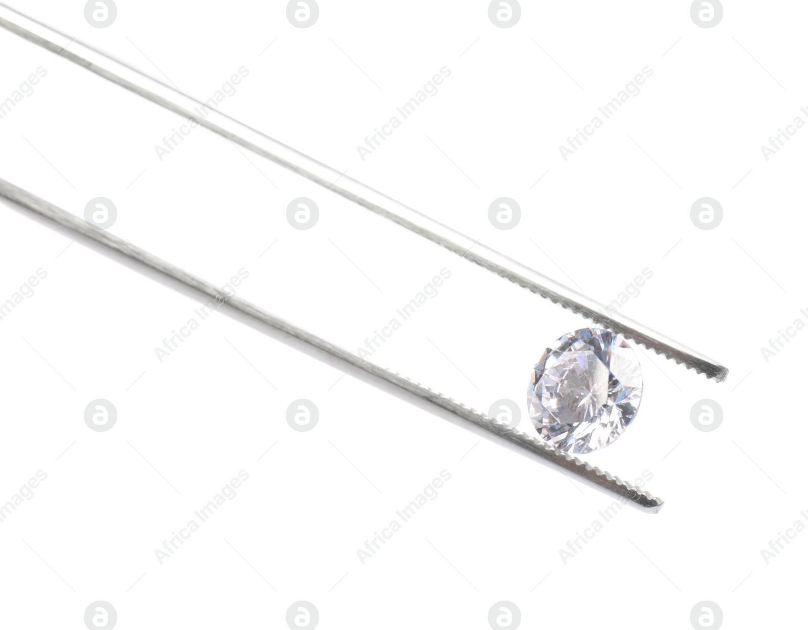 Photo of Tweezers with beautiful shiny diamond isolated on white