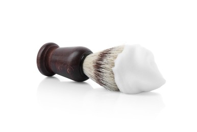 Photo of Shaving brush with foam isolated on white