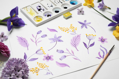 Photo of Composition with watercolor paints and floral picture on white background