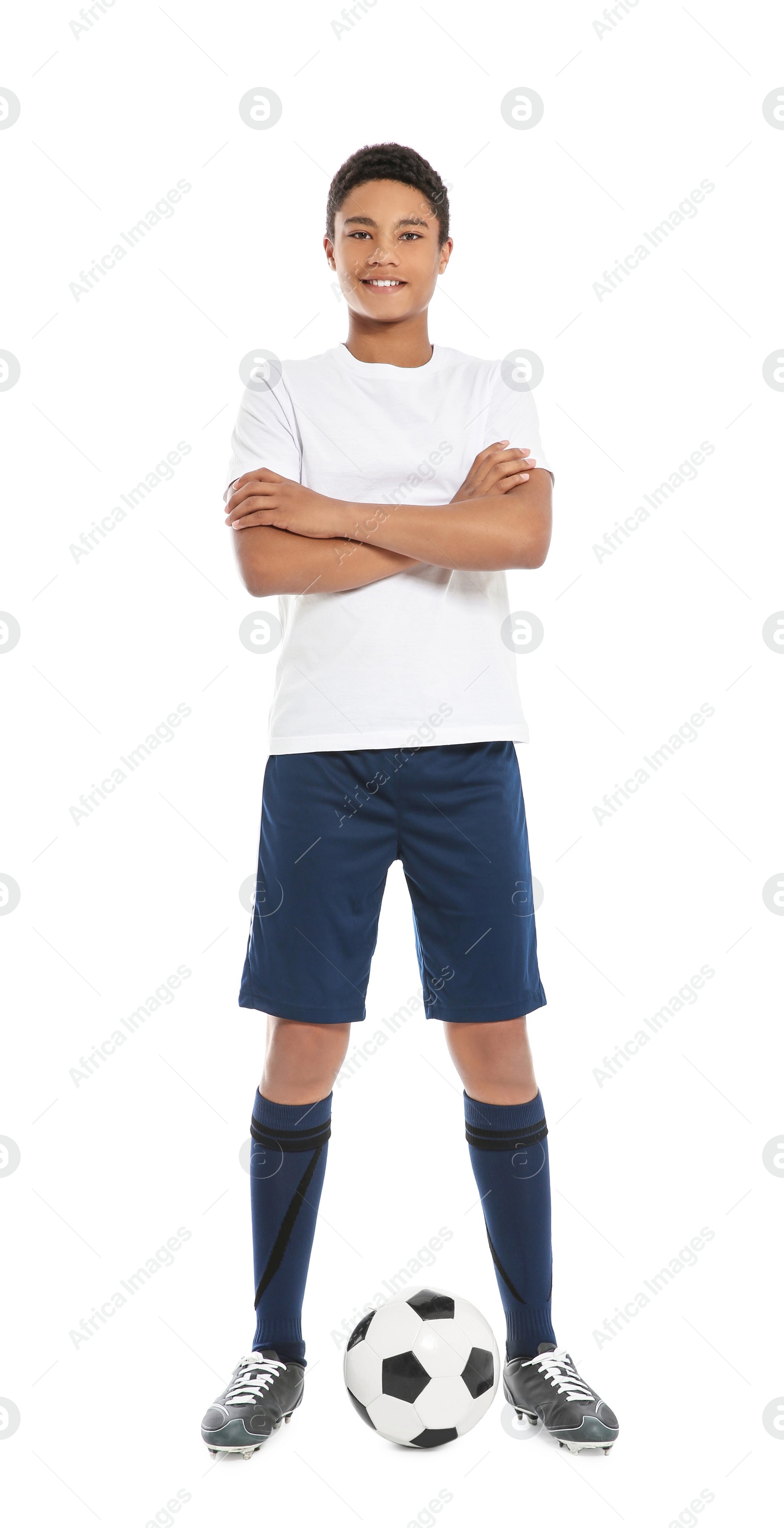 Photo of Teenage African-American boy playing football on white background