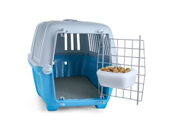 Light blue pet carrier with bowl of dry food isolated on white