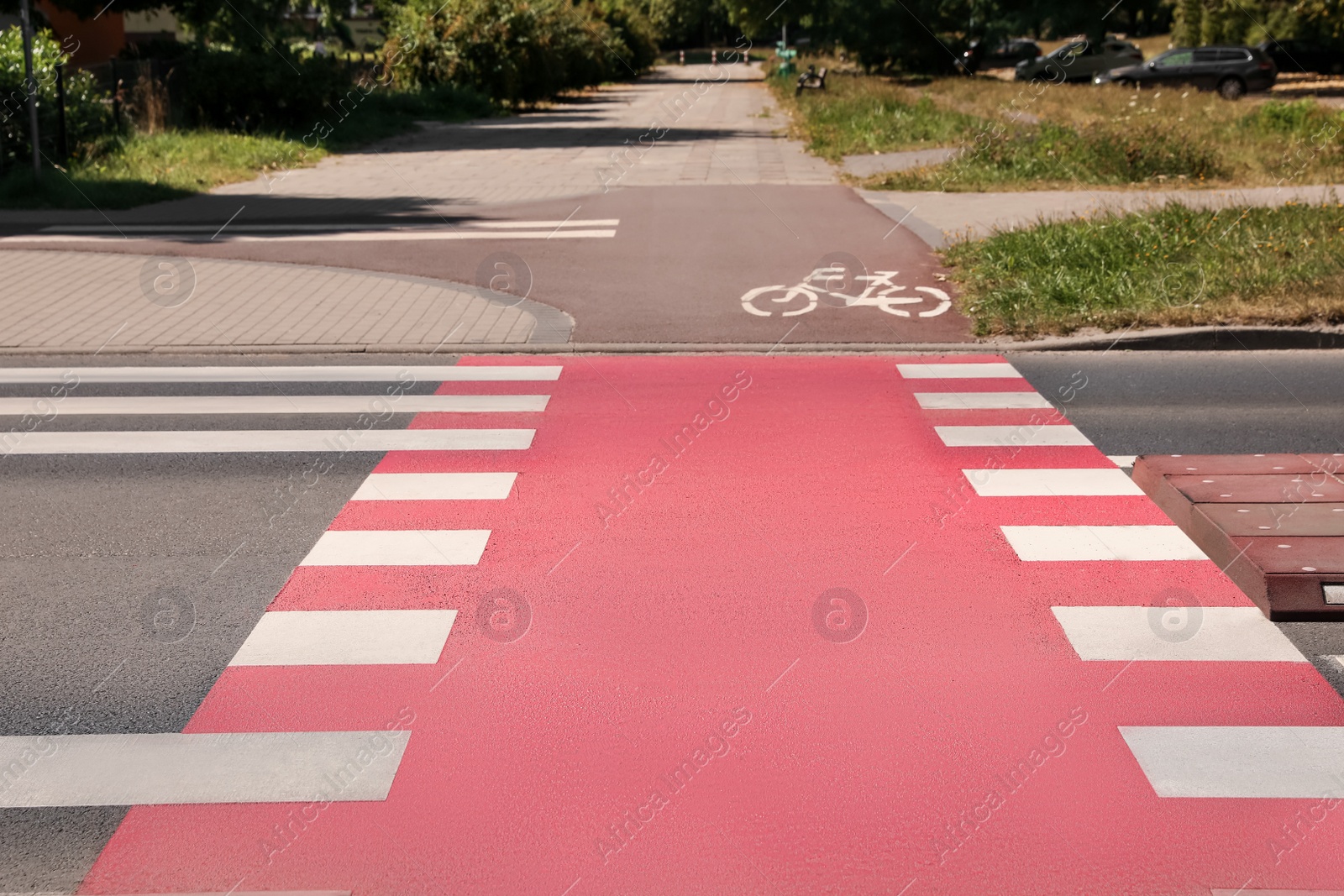 Photo of Bicycle lane with painted white sign and pedestrian crossing outdoors