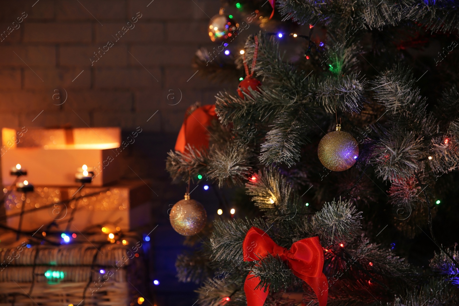 Photo of Christmas tree with beautiful decorations indoors, closeup. Stylish interior element