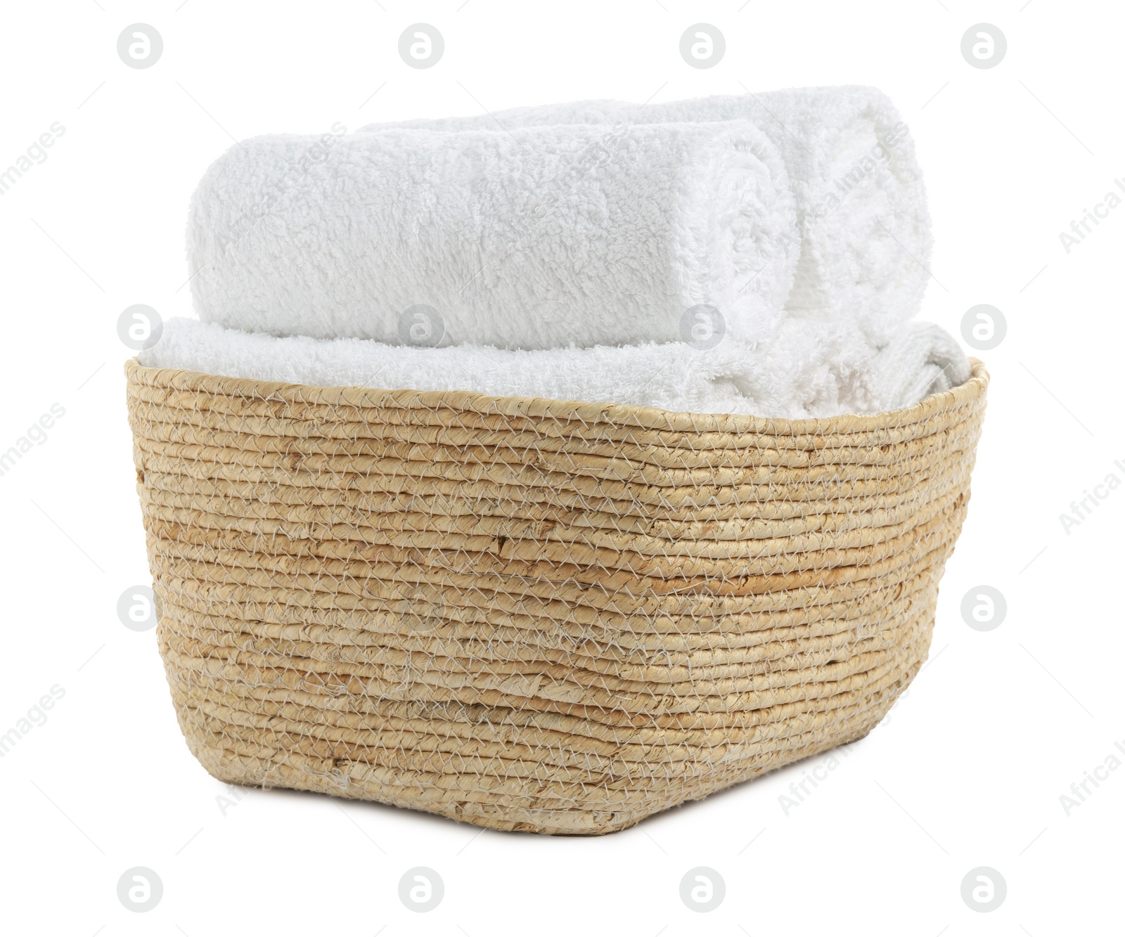 Photo of Wicker laundry basket with clean towels isolated on white