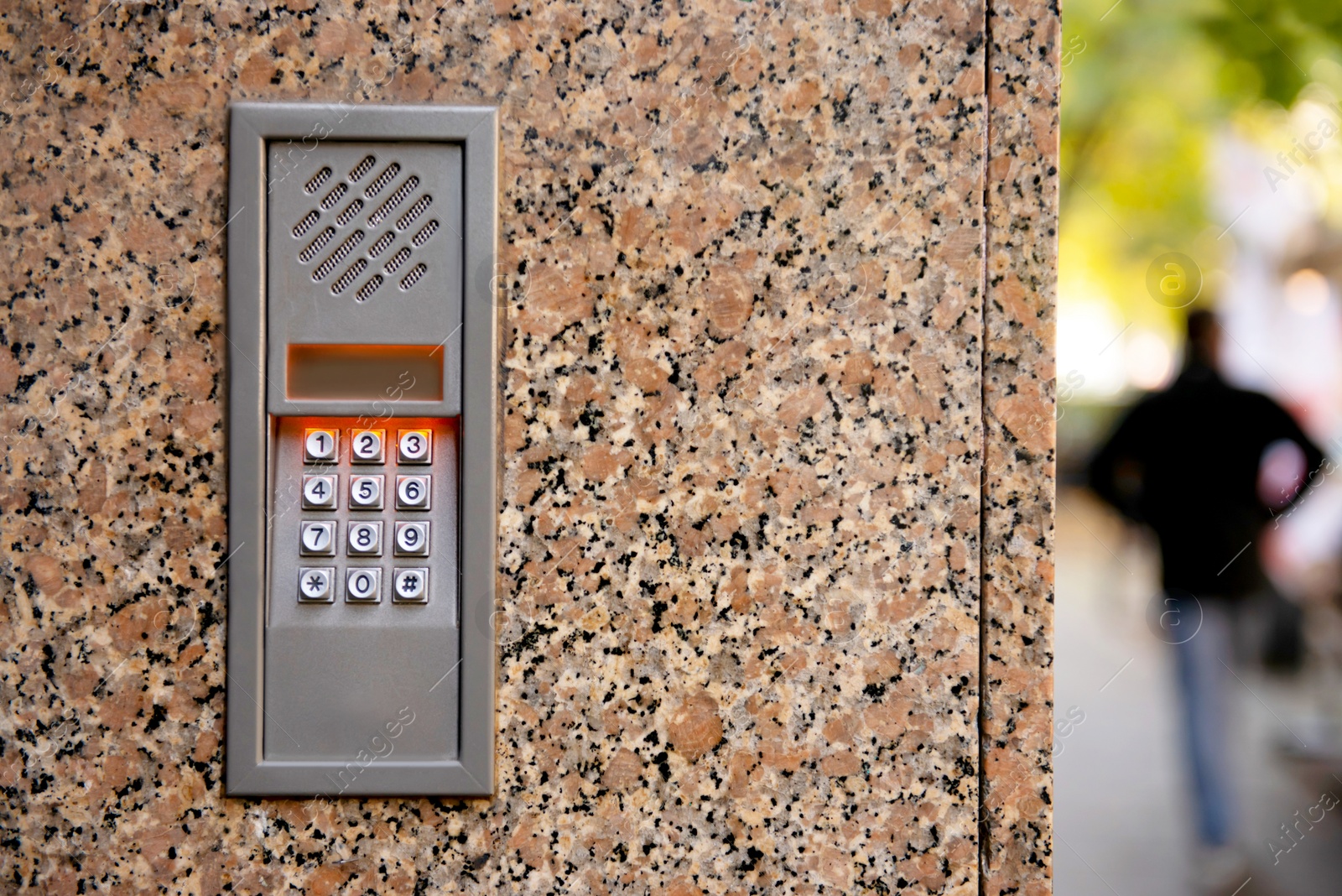 Photo of Home security system on stone wall outdoors, closeup. Space for text