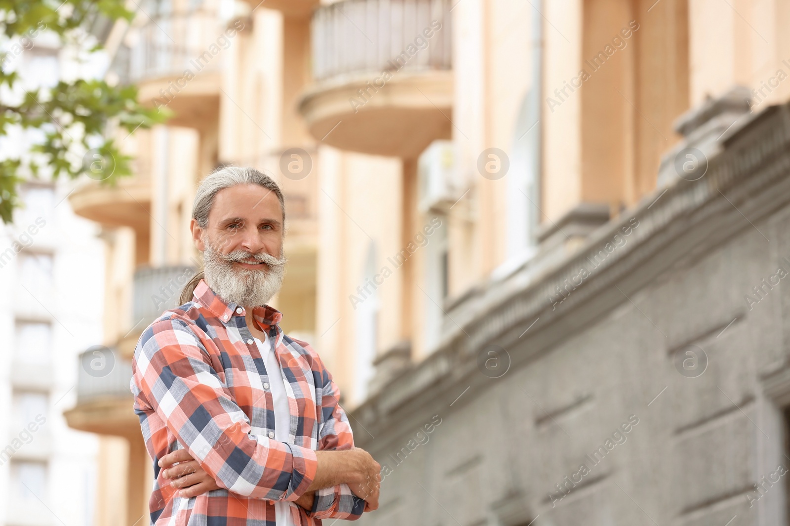 Photo of Portrait of handsome bearded mature man, outdoors