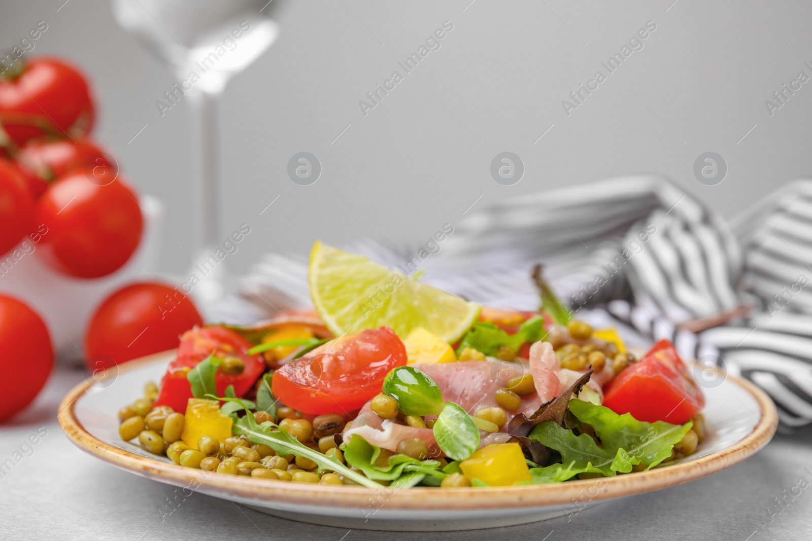 Photo of Plate of salad with mung beans on white table