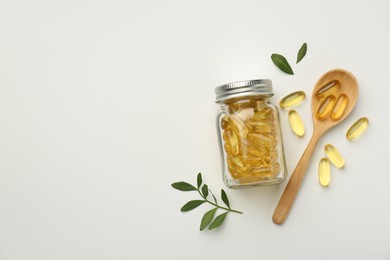 Bottle, vitamin capsules, spoon and leaves on white background, flat lay. Space for text