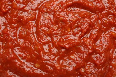 Photo of Homemade tomato sauce as background, top view