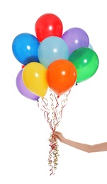 Woman holding bunch of bright balloons on white background, closeup