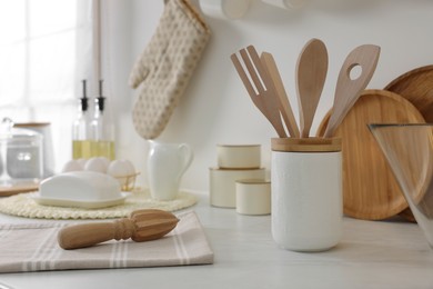 Set of different utensils and dishes on countertop in kitchen