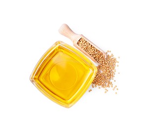 Photo of Bowl of natural oil and wooden scoop with mustard seeds on white background, top view