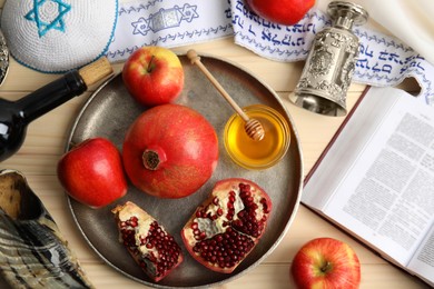 Photo of Flat lay composition with Rosh Hashanah holiday attributes on wooden table