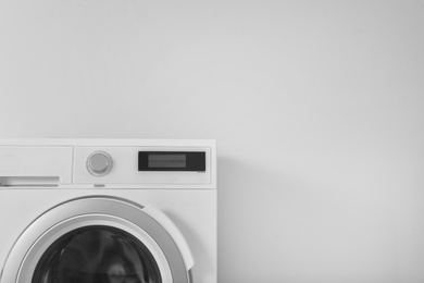 Washing machine and space for text on white background. Laundry day