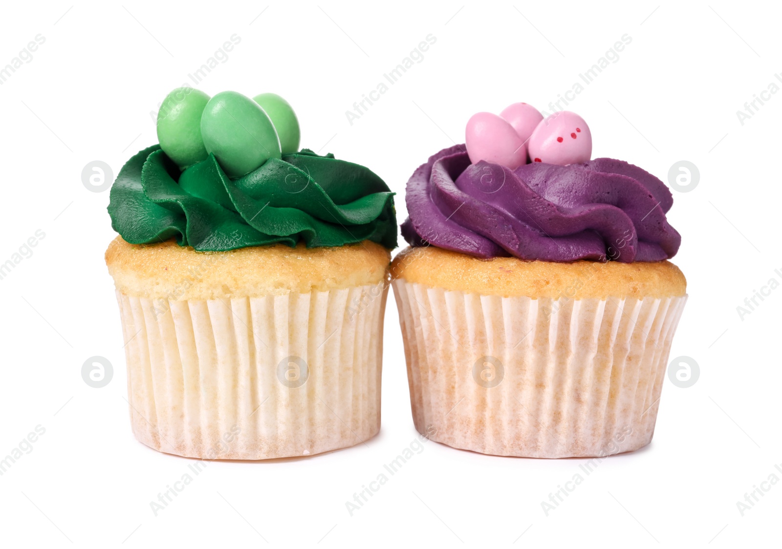 Photo of Tasty decorated Easter cupcakes isolated on white