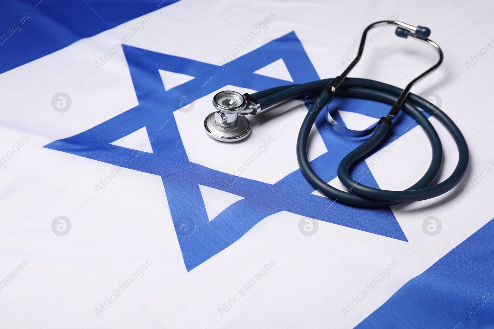 Photo of Stethoscope on flag of Israel. Health care concept