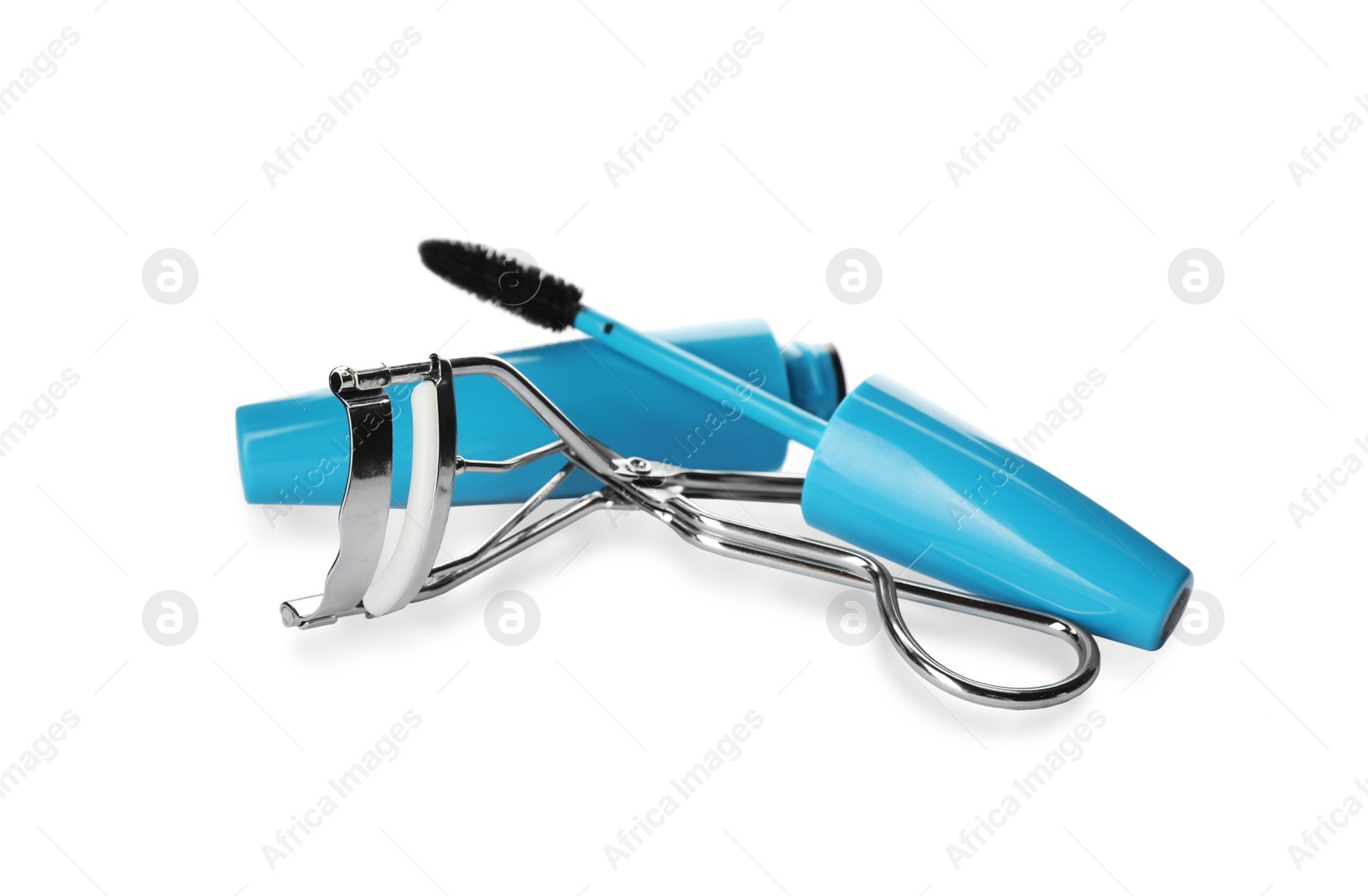 Photo of False eyelashes, curler and mascara on white background