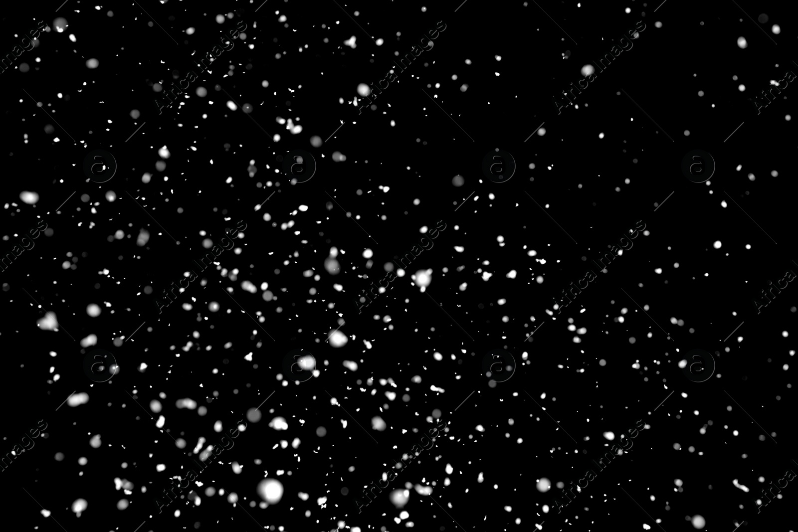 Photo of White snow falling down on black background