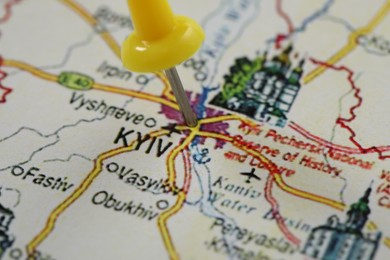 MYKOLAIV, UKRAINE - NOVEMBER 09, 2020: Kyiv city marked with push pin on map of Ukraine, closeup