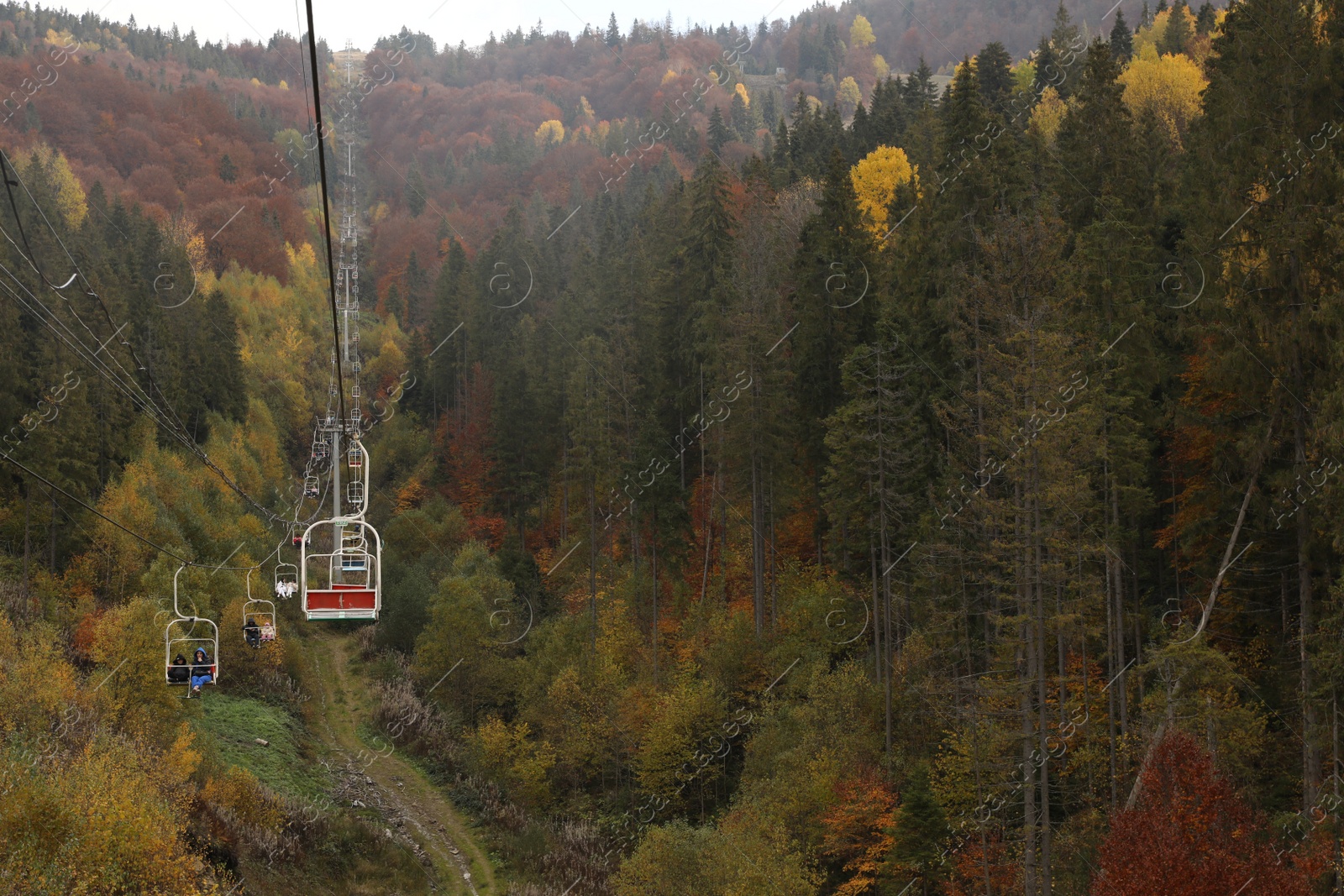 Photo of Chairlift with comfortable seats at mountain resort