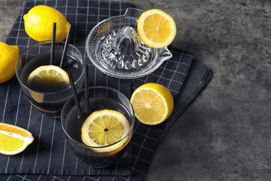 Photo of Glasses with natural black lemonade on table