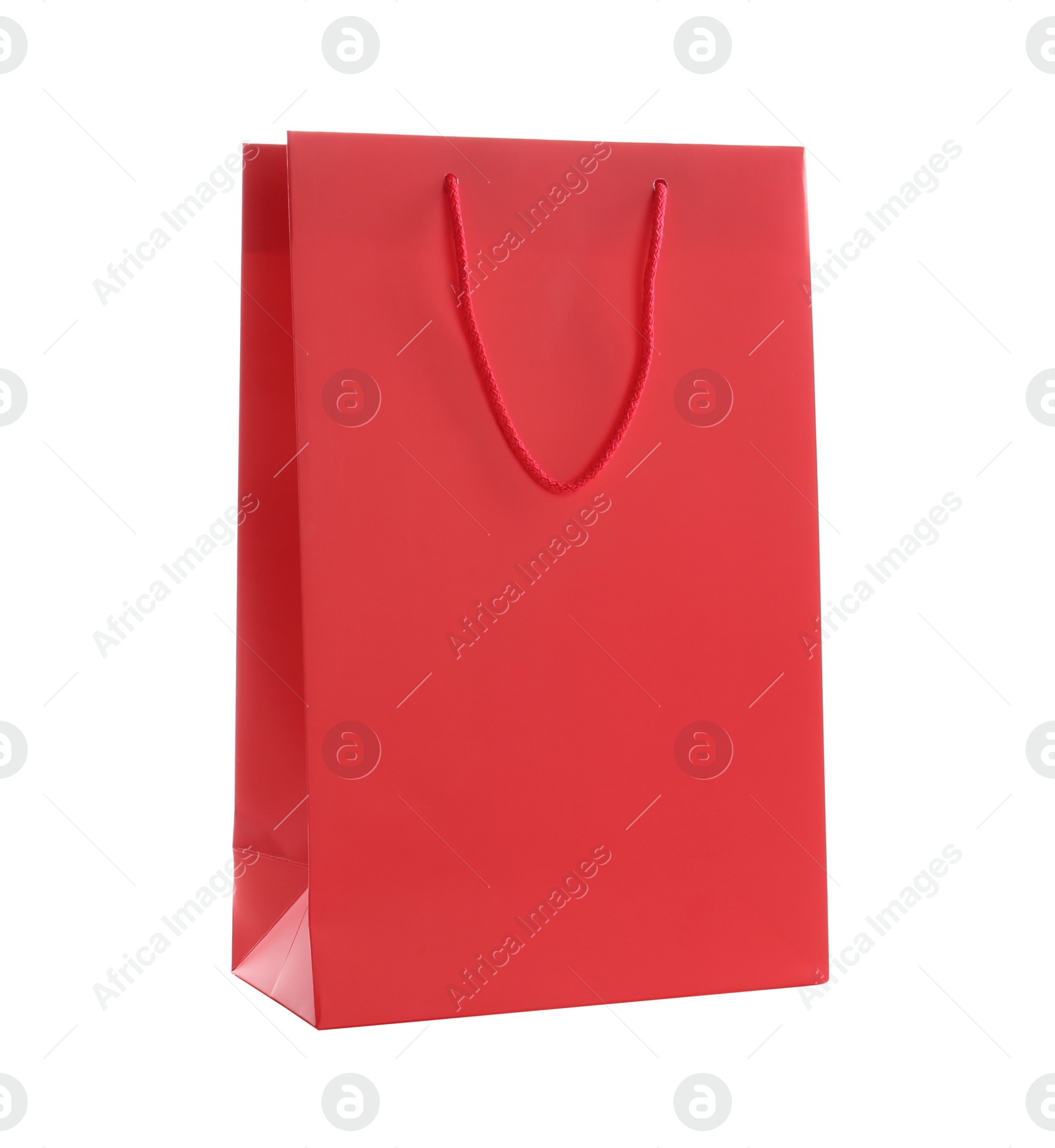 Photo of Red paper shopping bag isolated on white