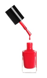 Brush over nail polish bottle on white background