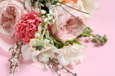 Photo of Bouquet of beautiful flowers on pink background, closeup