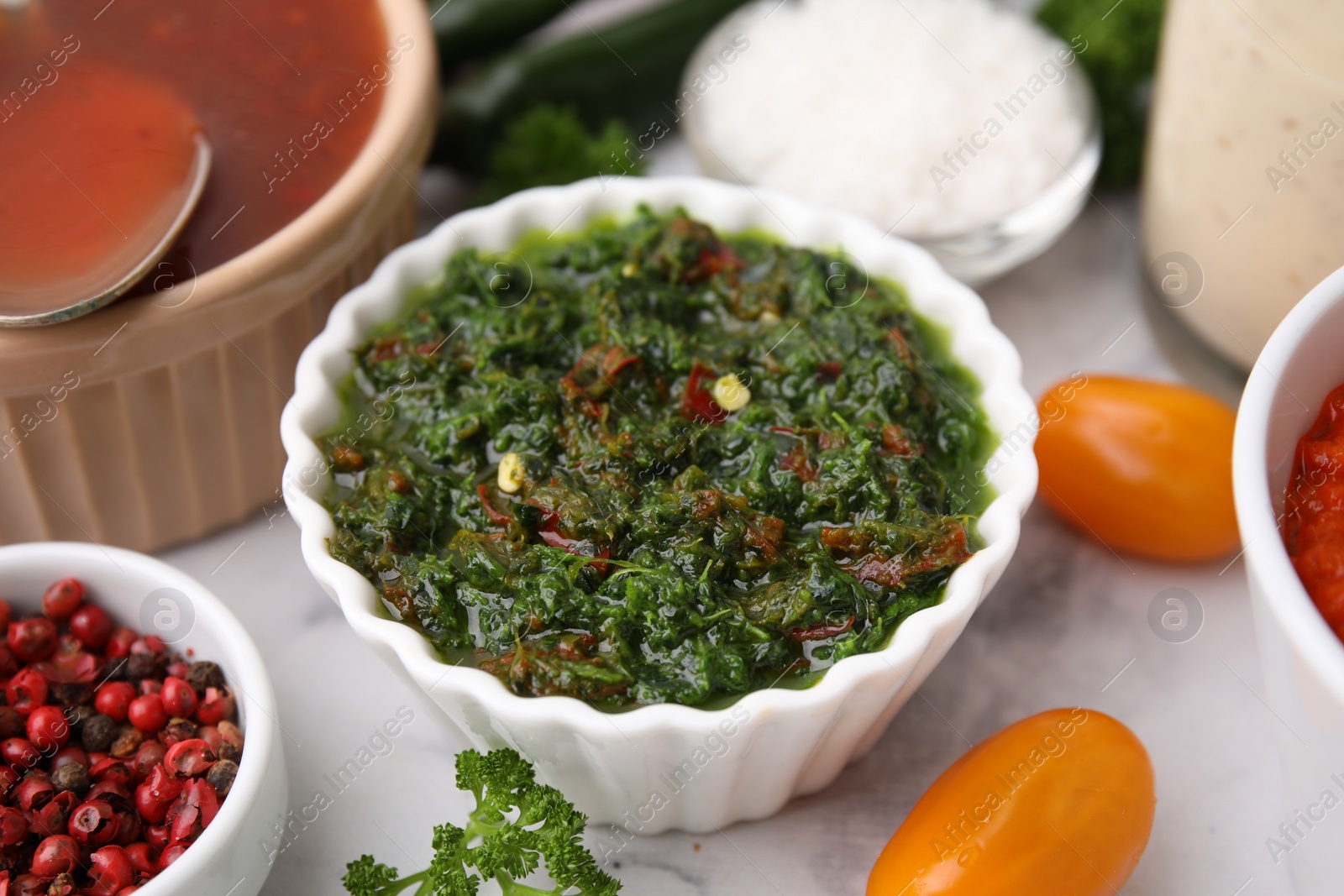 Photo of Fresh homemade marinade in bowl on table, closeup