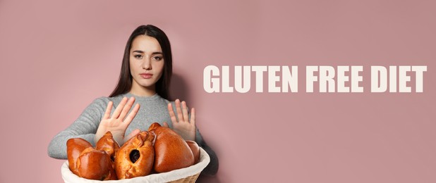 Image of Gluten free diet. Woman refusing from wicker basket with pastries on dusty pink background, banner design