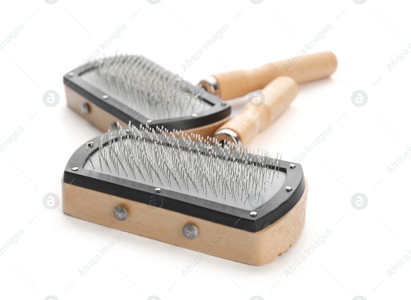 Photo of Brushes for cats on white background. Pet care