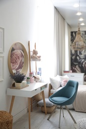 Photo of Teenage girl's bedroom interior with stylish furniture. Idea for design