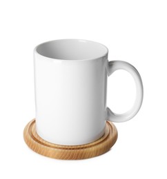 Mug and stylish wooden coaster on white background