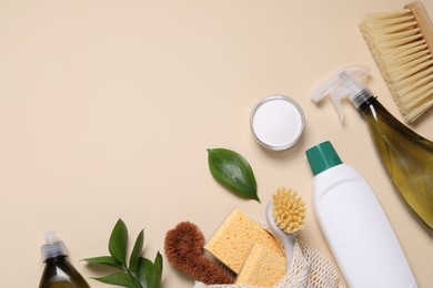 Flat lay composition with different cleaning supplies on beige background. Space for text