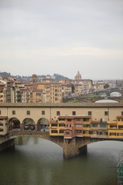 Florence, Italy - February 8, 2024: Picturesque view of city with beautiful buildings and river