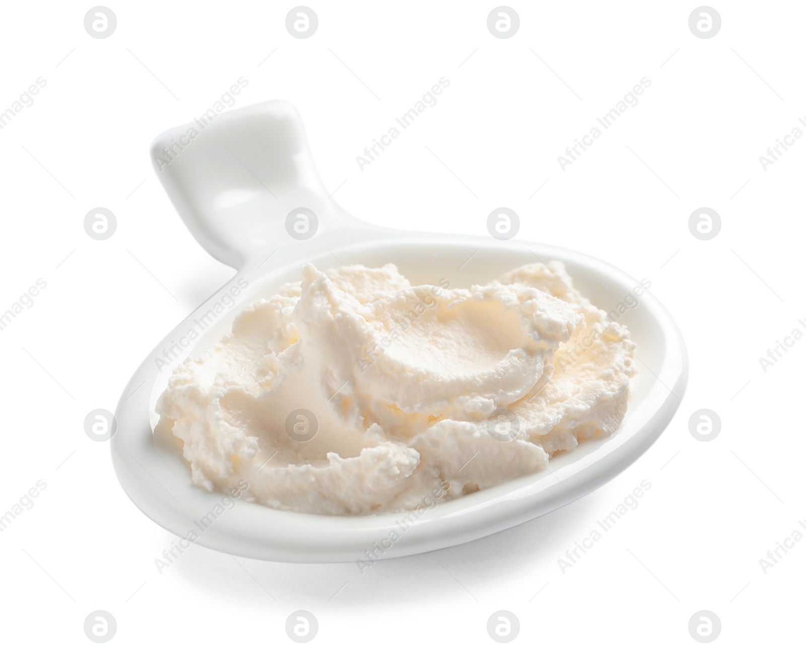 Photo of Serving spoon with tasty cream cheese on white background