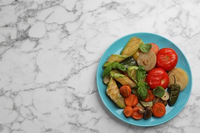 Delicious grilled vegetables on white marble table, top view. Space for text