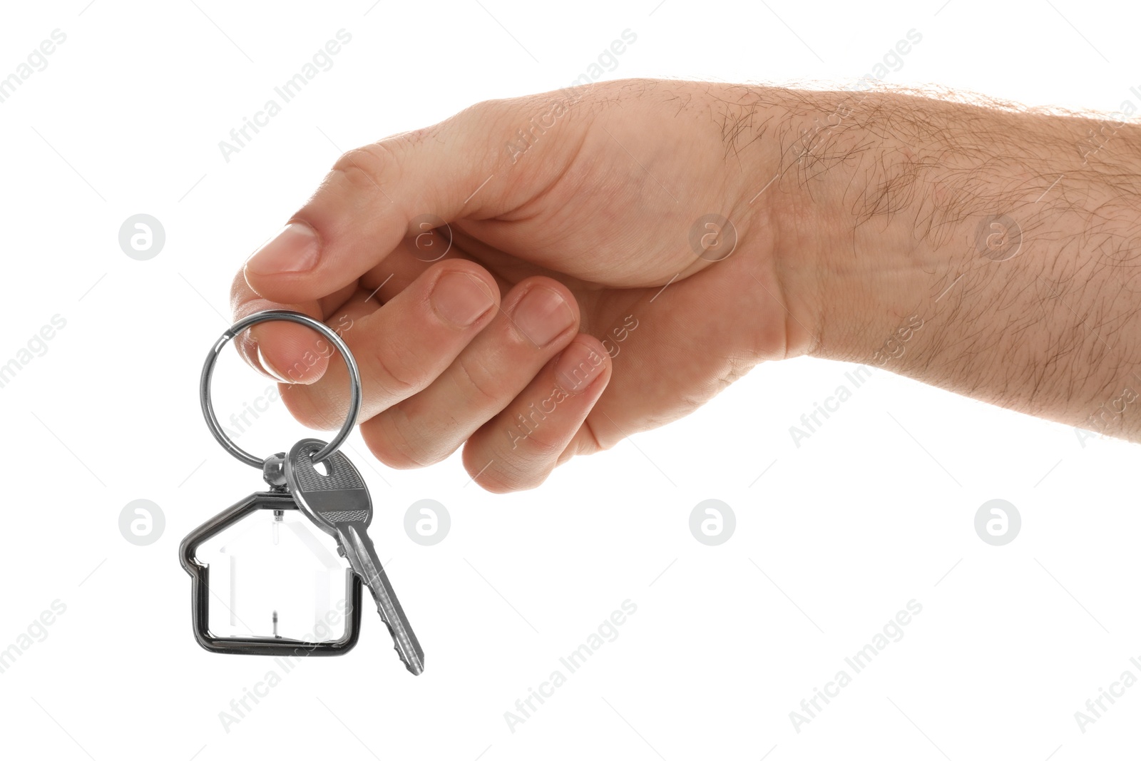 Photo of Real estate agent holding house key with trinket on white background, closeup