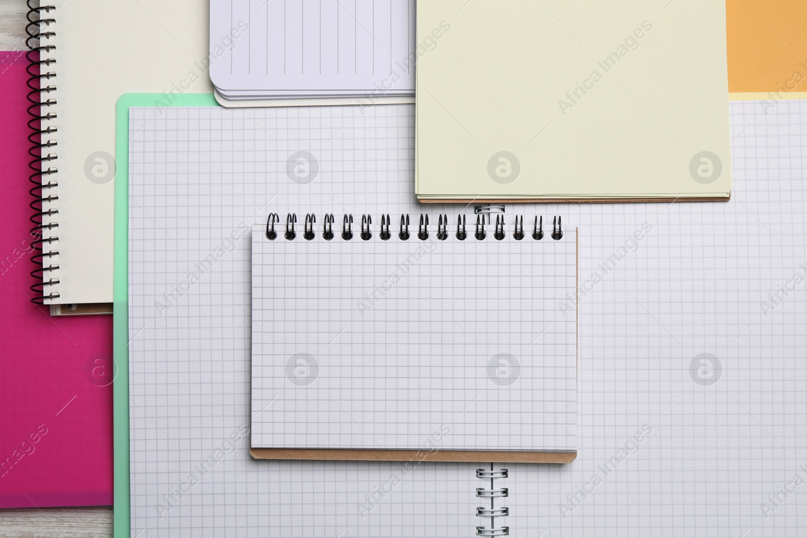 Photo of Many different notebooks as background, top view